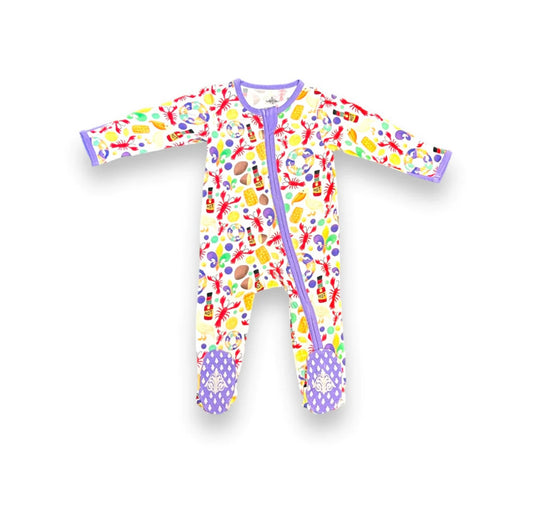 A baby's footed pajama with colorful Mardi Gras Crawfish Rhompers from the Belle Cher brand.