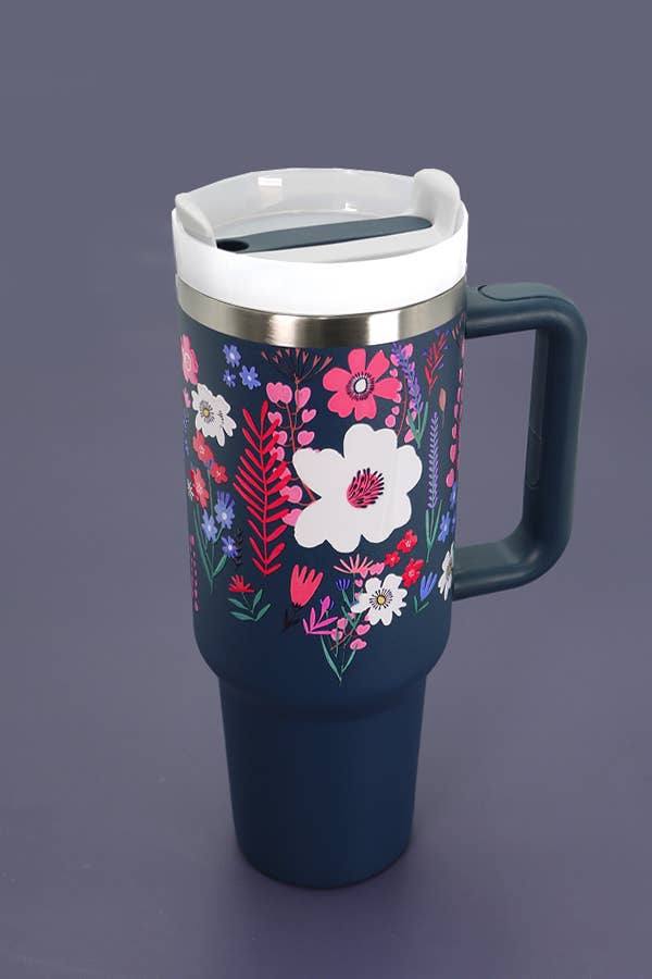 A 40oz Wall To Wall Accessories STAINLESS STEEL TUMBLER with a floral design on it, BPA-free.