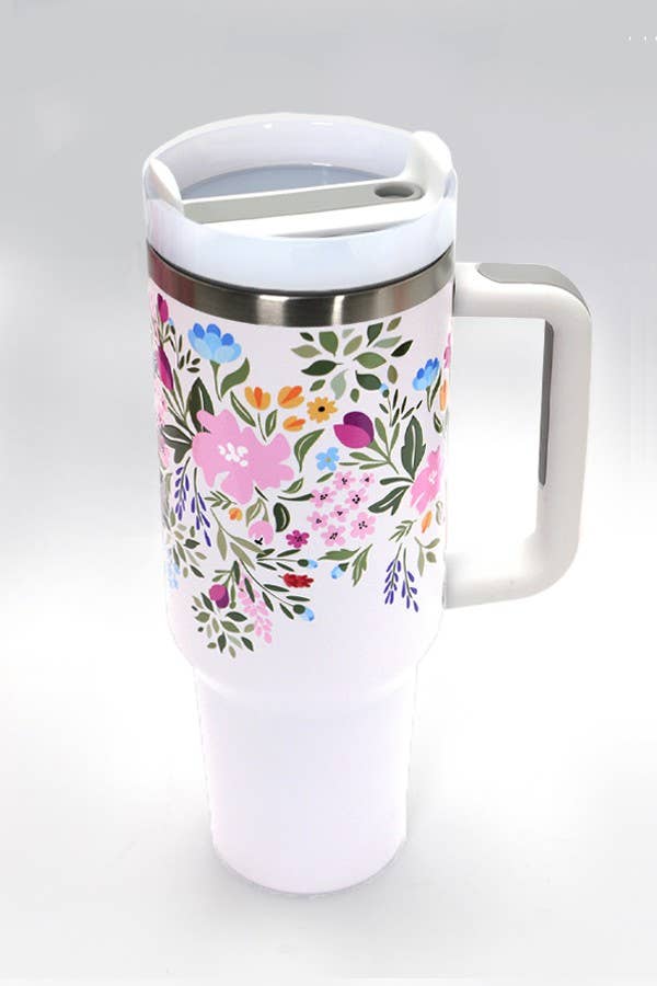 A Wall To Wall Accessories 40oz STAINLESS STEEL TUMBLER | PETAL LT PINK with a floral design on it.