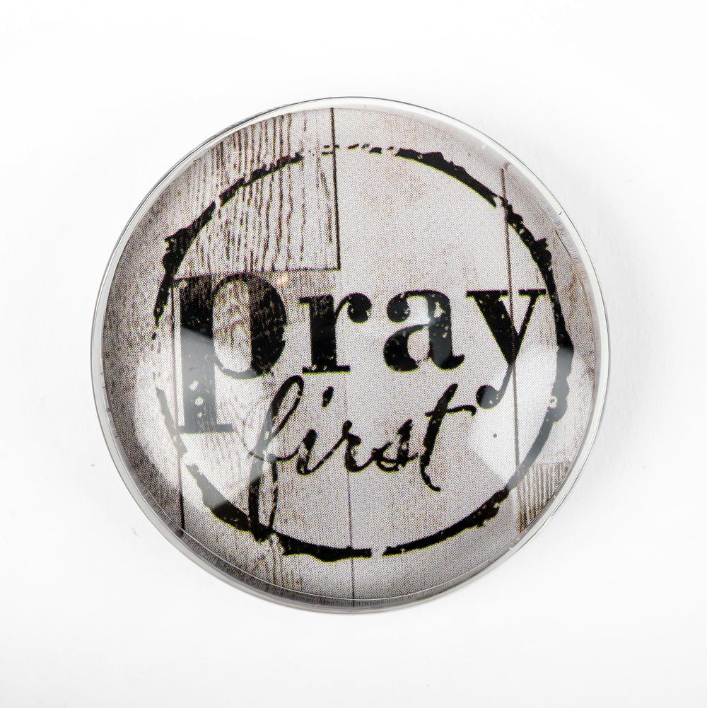 A Prayer Bubble Magnet with the words "Pray First" on it by Nicole Brayden.