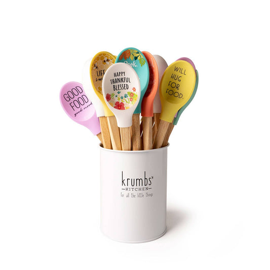 A cup filled with lots of colorful Krumbs Kitchen Homemade Happiness Spoons from DM Merchandising.