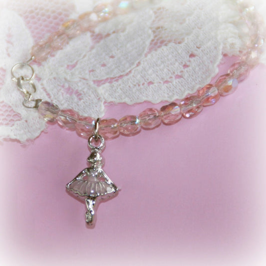 A Pink Crystal Ballerina Necklace from Collectables America with a little girl charm on it.