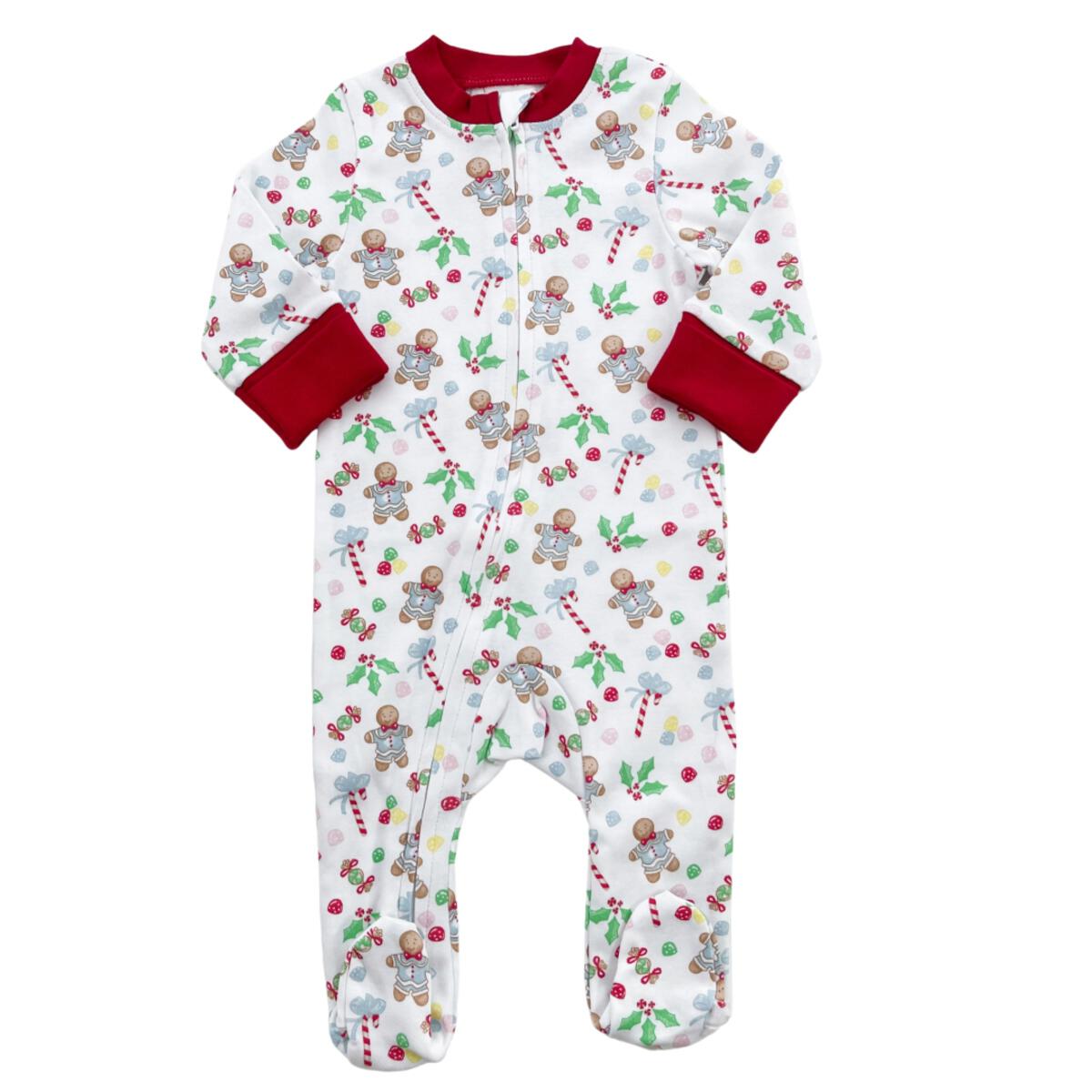 A baby's Chickie Collective Boy Gingerbread Footie Pajama with christmas decorations.