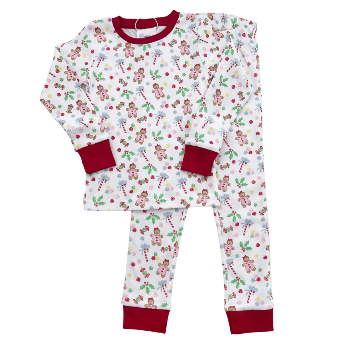 A Pink Gingerbread Pajama Pant Set from Chickie Collective for a baby.