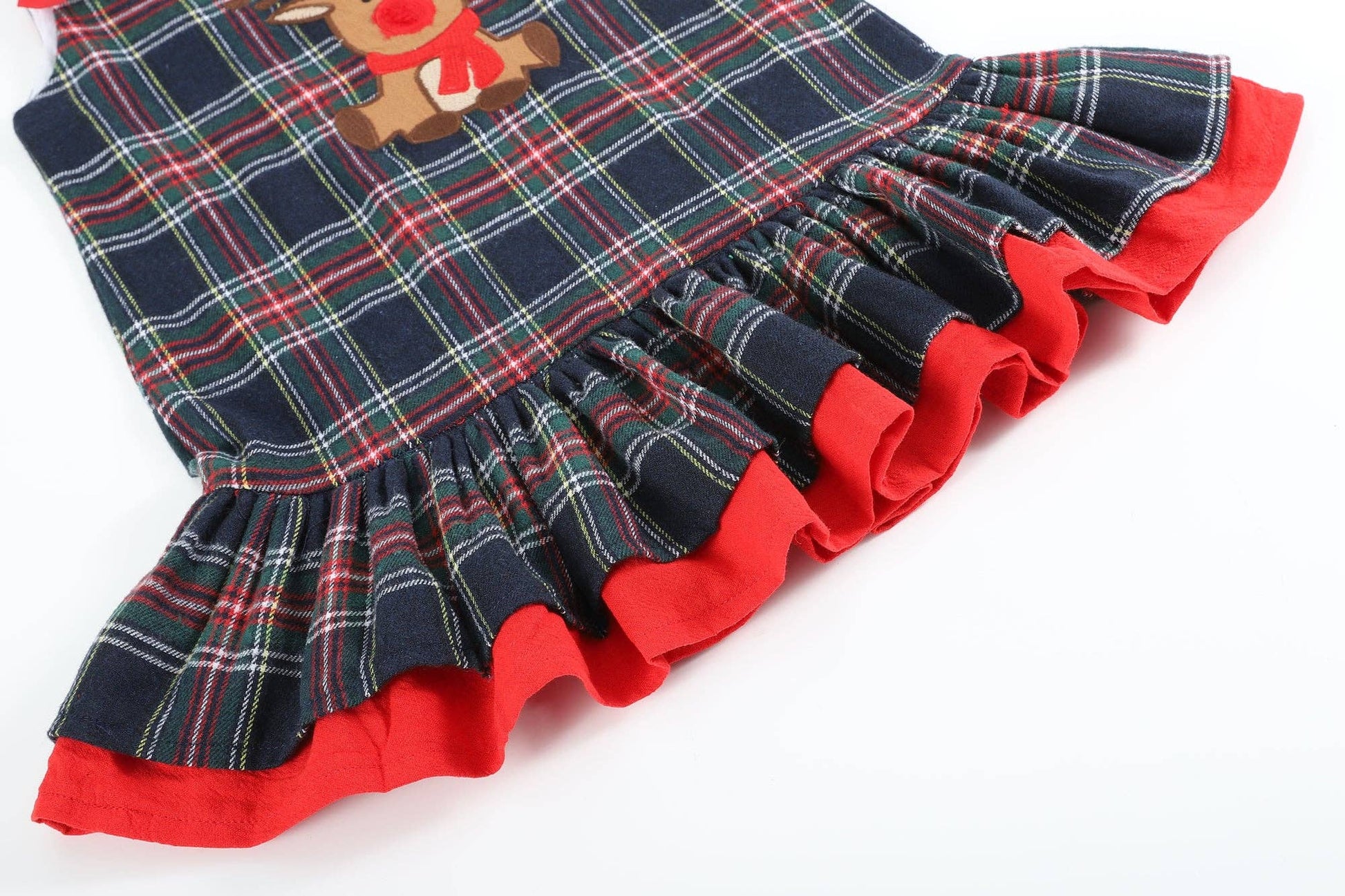 A Navy and Red Plaid Reindeer Ruffle Dress by Lil Cactus, perfect for holiday fun.