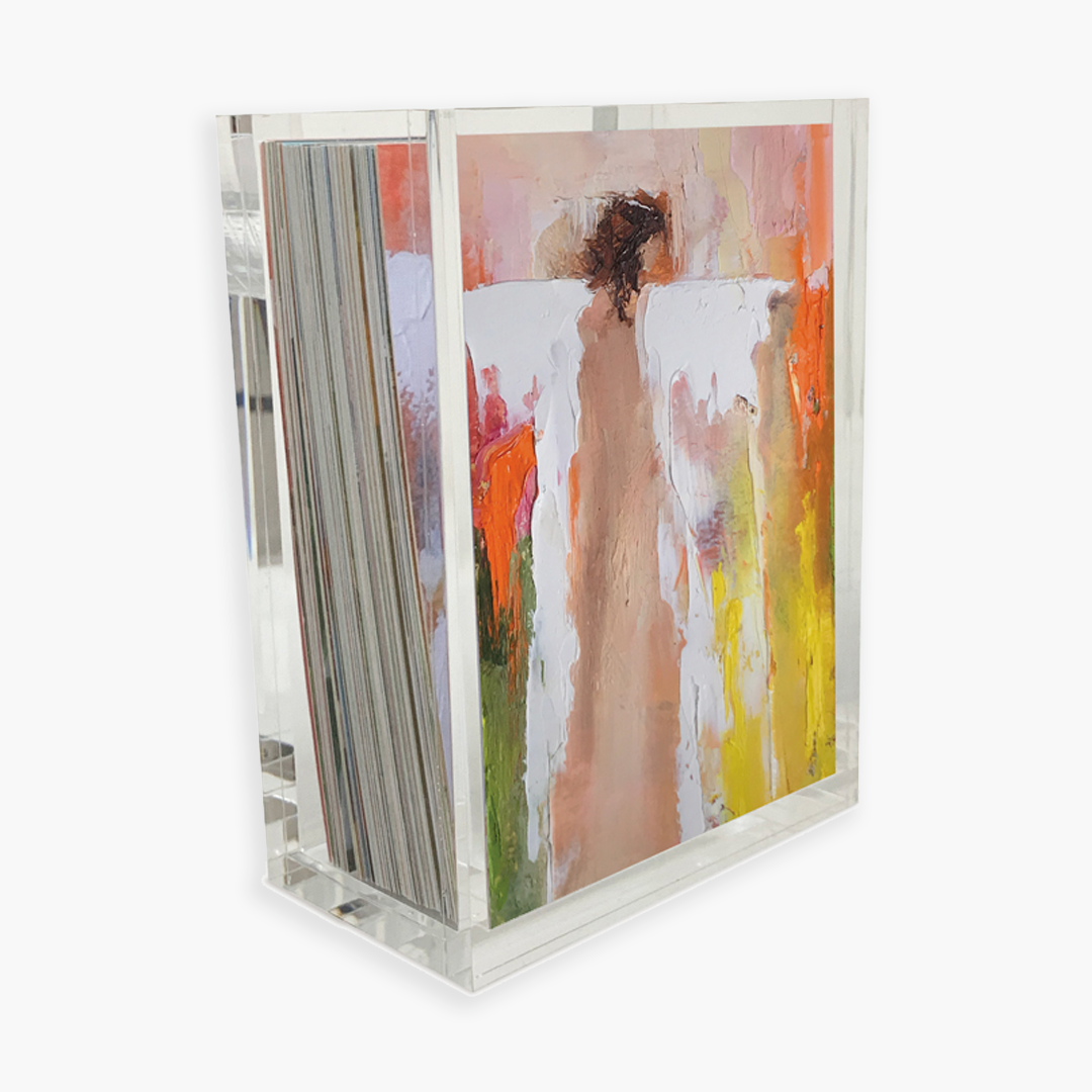 An Anne Neilson magazine holder adorned with a beautiful painting that exudes the power of gratitude and encourages a positive mindset: 100 Days of Gratitude.