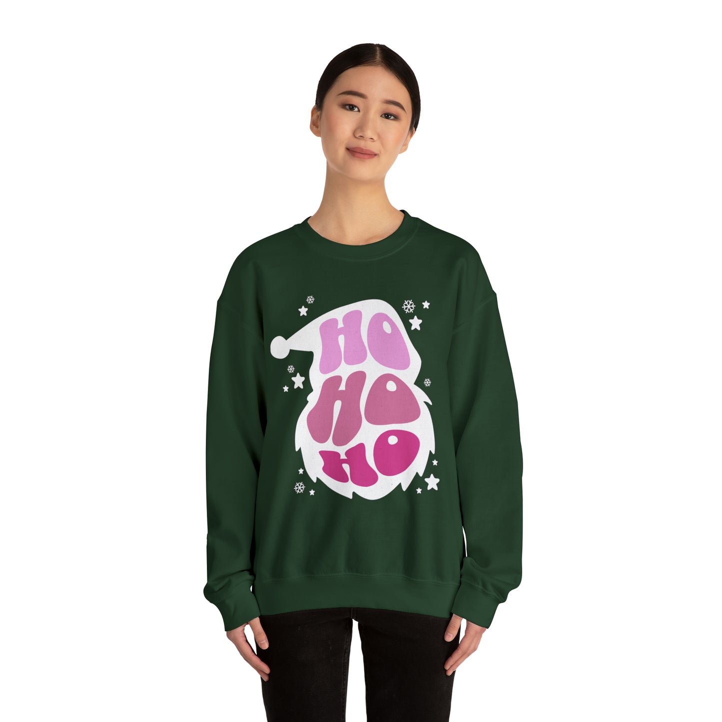 A woman wearing a stylish green Ho Ho Ho Santa Outline Pink Holiday Sweatshirt adorned with a comfortable pink Santa Claus design by Printify.