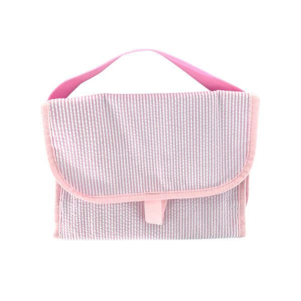 The Mint Hang Around Seersucker | Pink toiletry bag, perfect for travel organization, featured on a white background.