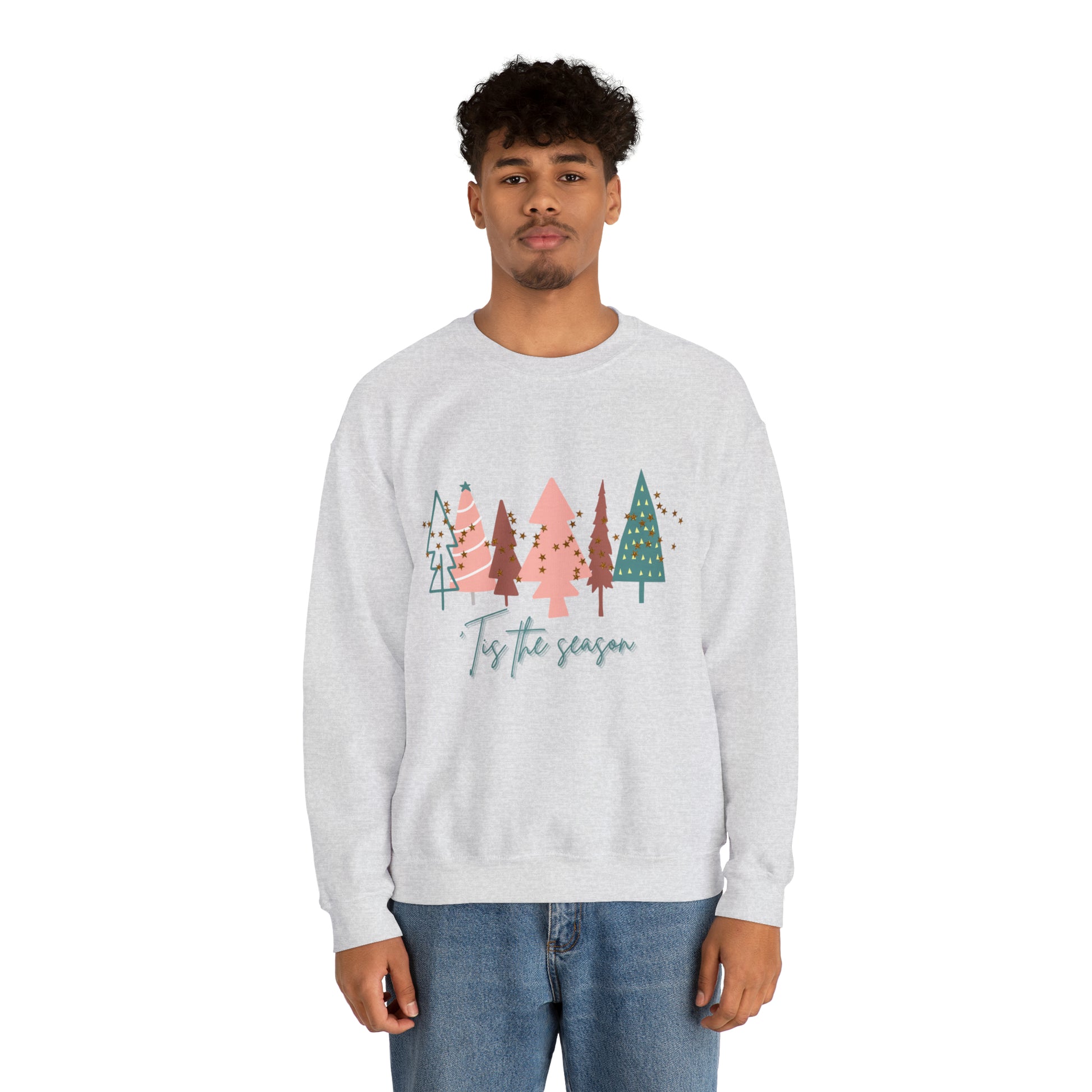 A man cozy in his Printify Christmas Tree Sweatshirt, showcasing the ethical production.