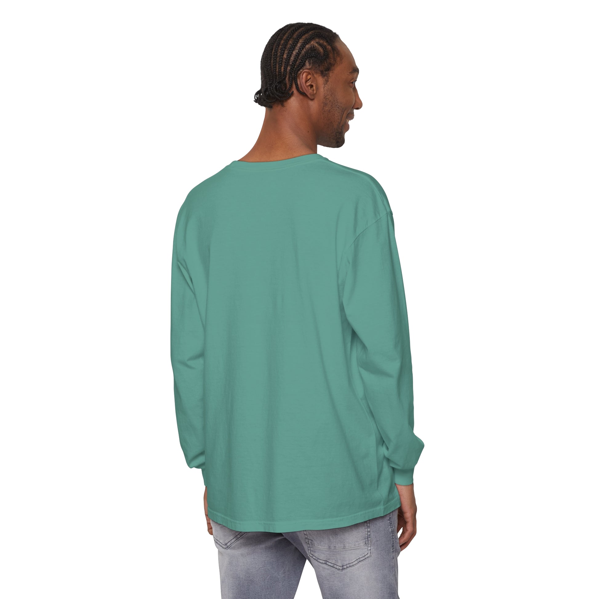 The back of a man wearing a cozy and stylish green long sleeve t-shirt, the Copy of Tis the Season Ivory Christmas Tree Shirt from his winter wardrobe by Printify.