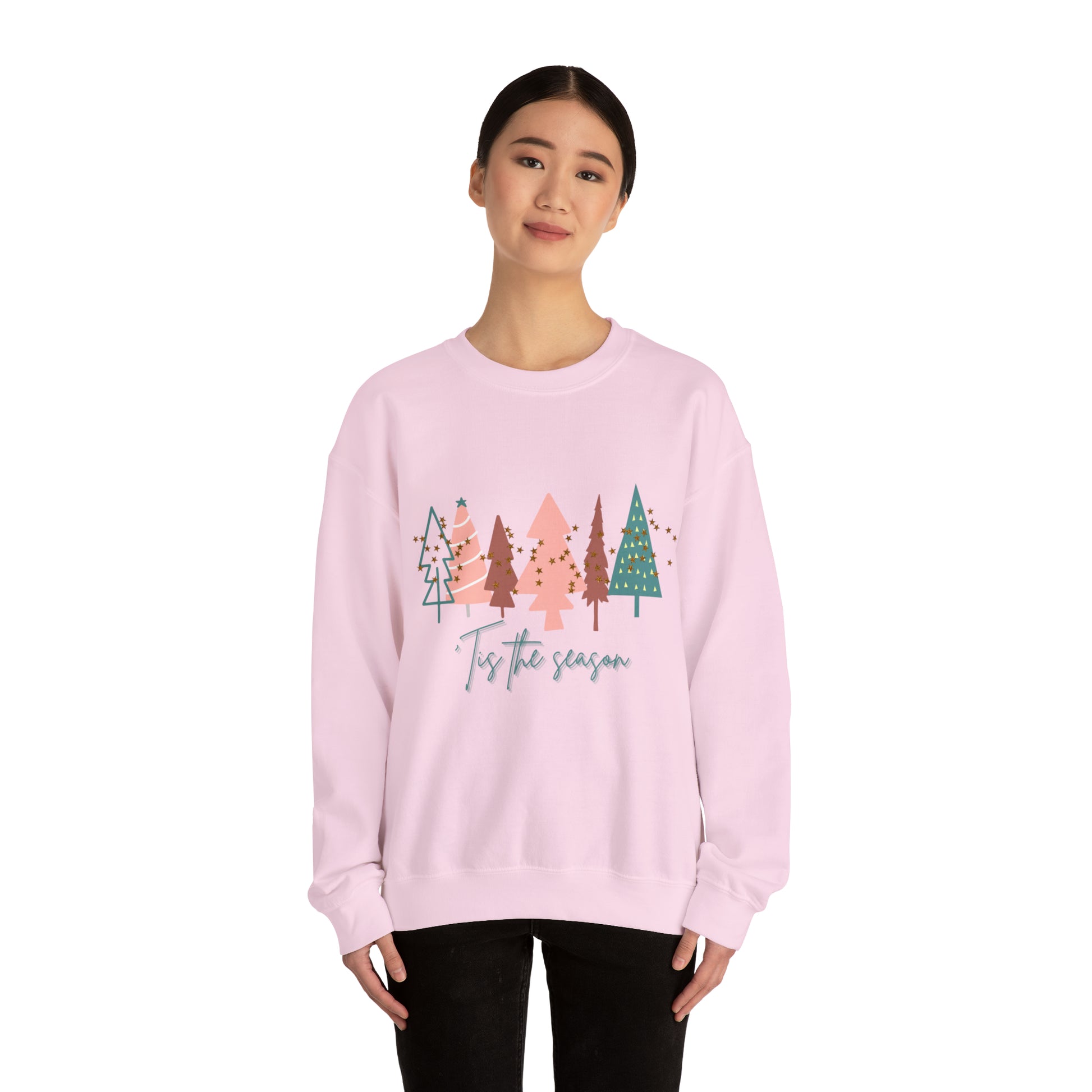 A woman wearing a Printify Christmas Tree Sweatshirt.