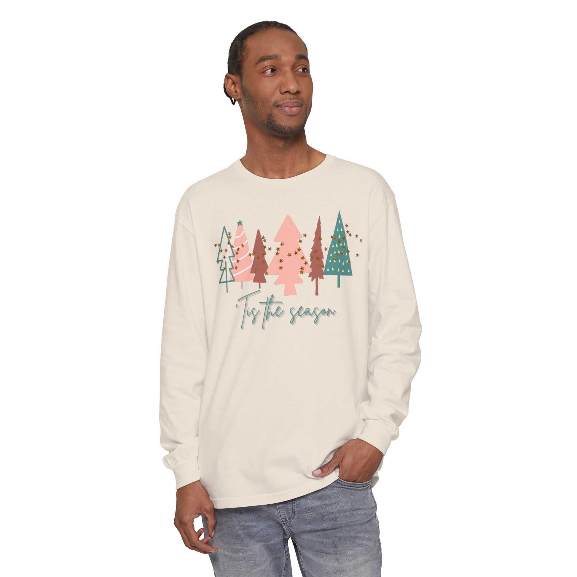 A man showcasing his Christmas style with a comfortable and stylish unisex long sleeve Tis the Season Christmas Tree Shirt featuring a festive Christmas tree print. Perfect addition to your winter wardrobe. - Printify Comfort Colors