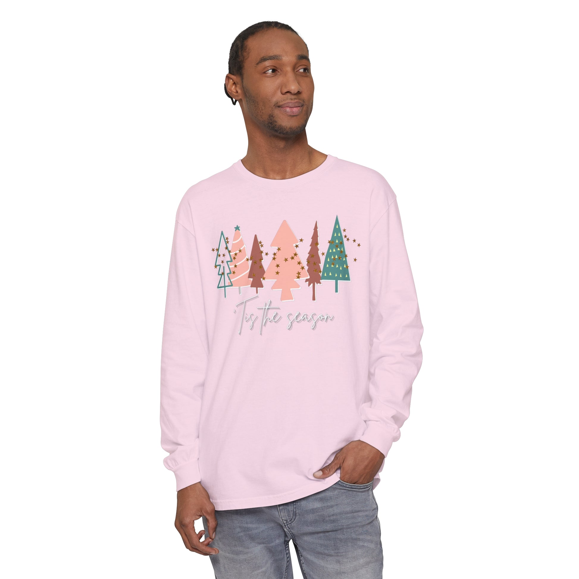 A man wearing a Tis the Season Christmas Tree Shirt by Comfort Colors, showcasing comfort and style in his winter wardrobe.