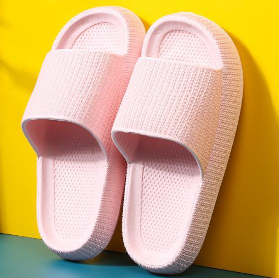 A pair of Wall to Wall Air Cloud Sandals on a yellow background.