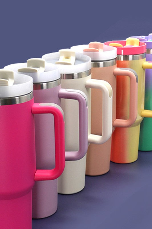 A row of different colored Hotline Wholesale 40oz Stainless Tumblers with Handle.