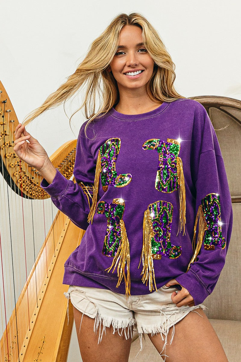 A woman is posing with a harp in front of a BiBi Sparkling Purple Sequin Fringed Mardi Gras Boots. Stand out and shimmer in style!