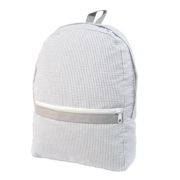 A Seersucker Backpack in Grey by Mint with a zipper on the front.