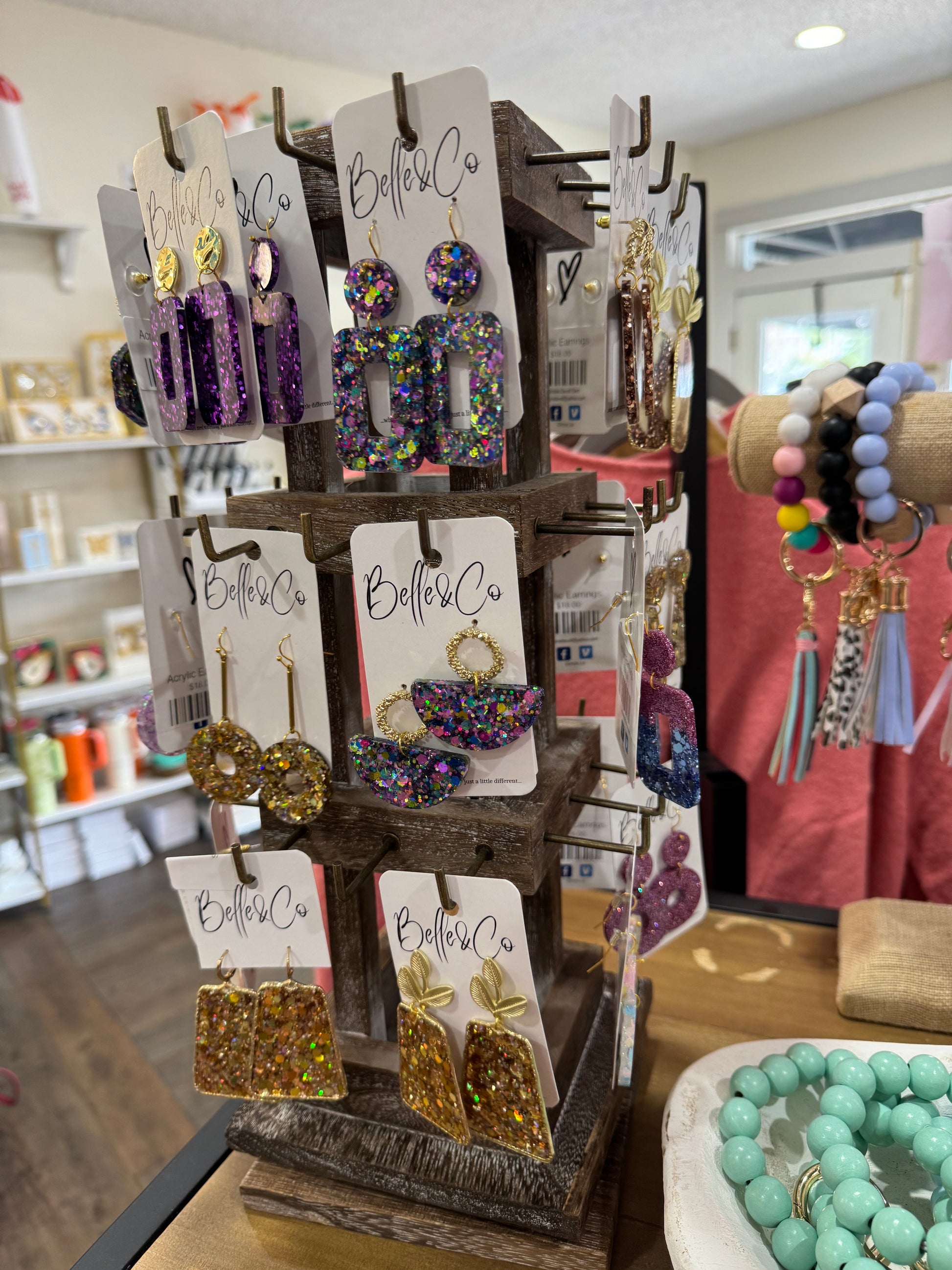 A display of Chickie Collective acrylic earrings and bracelets in a store.