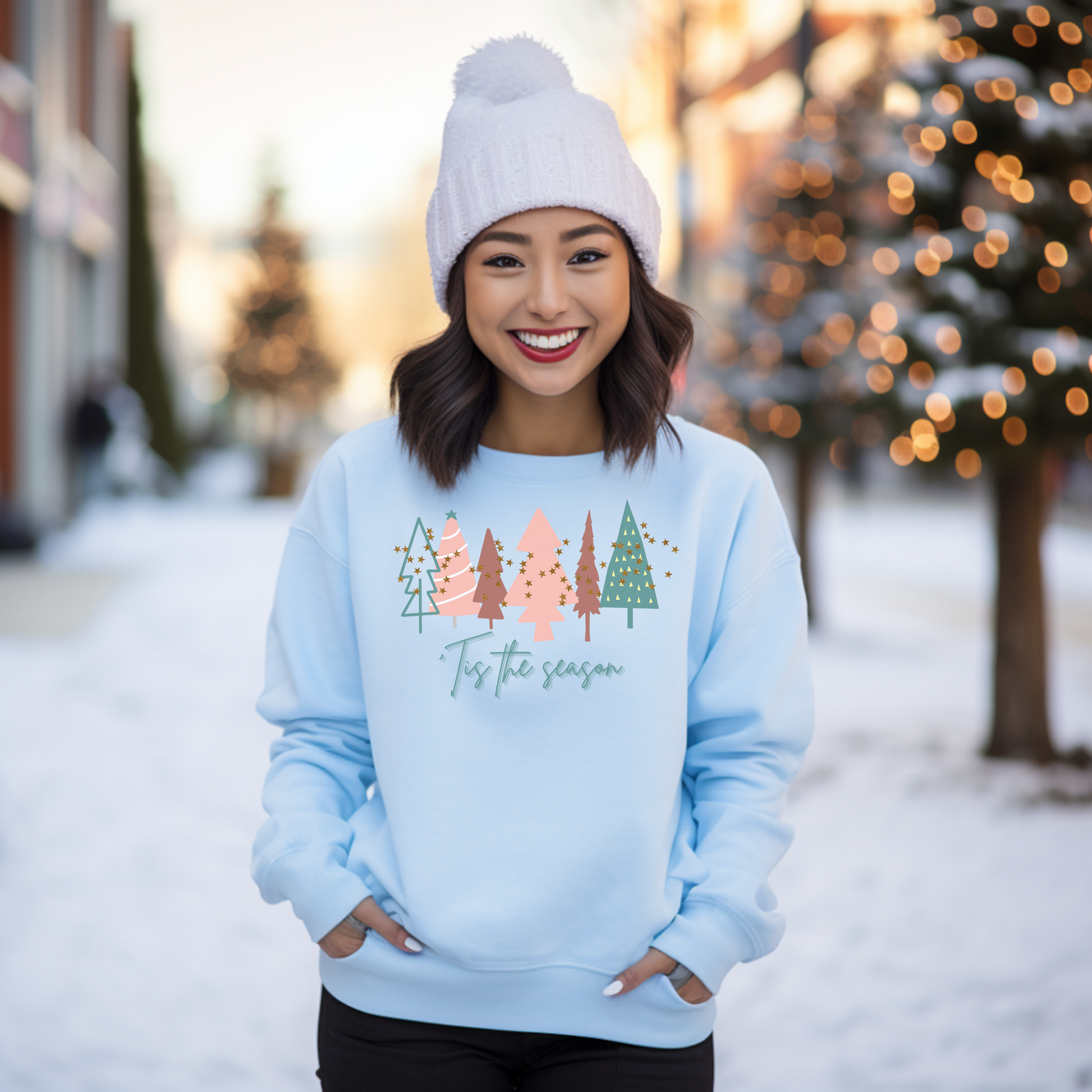 A woman wearing a cozy Light Blue Christmas Tree Sweatshirt by Printify.