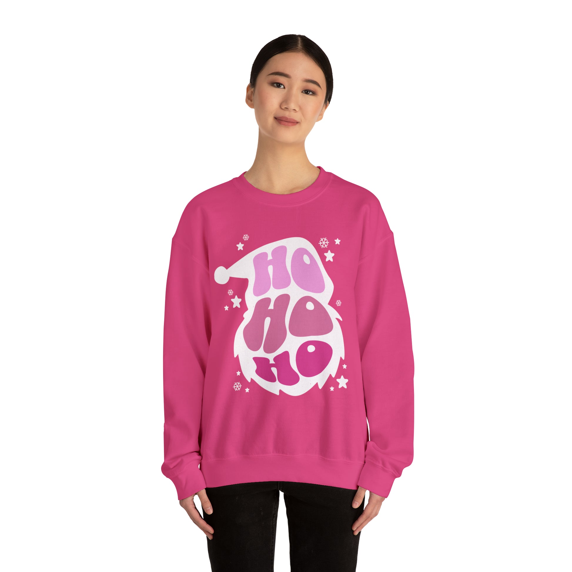 A woman sporting a cozy Printify crewneck sweatshirt in pink with the words Ho Ho Ho Santa Outline on it.