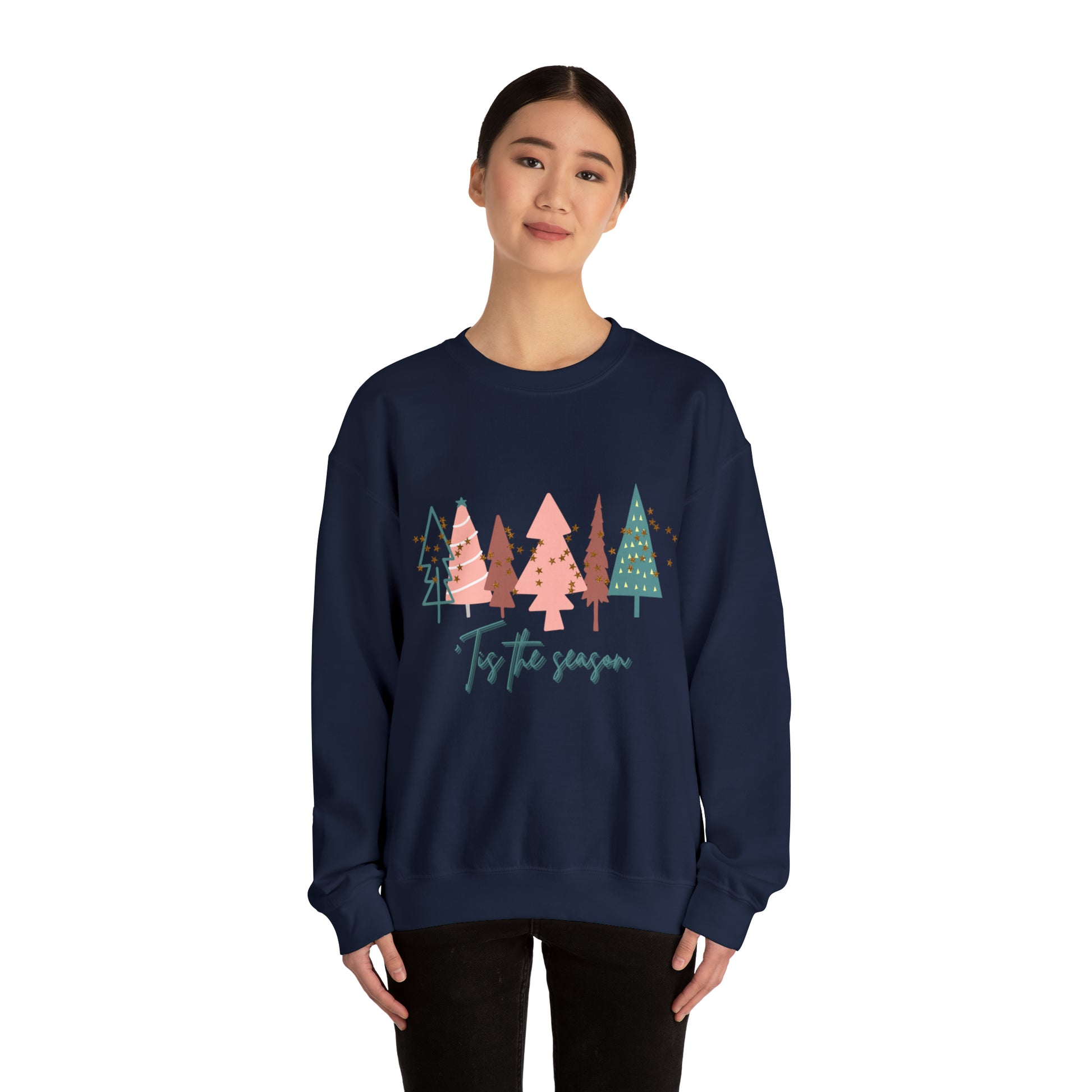 A cozy woman wearing a warm Christmas Tree Sweatshirt by Printify.