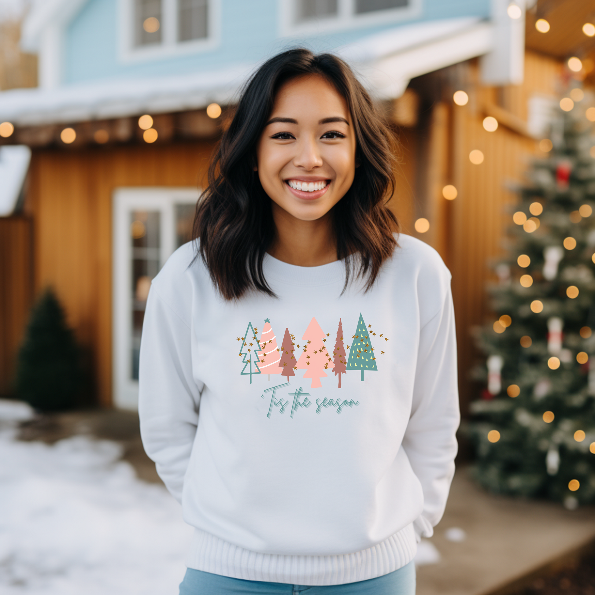 A woman wearing a cozy White Christmas Tree Sweatshirt by Printify during the winter months.