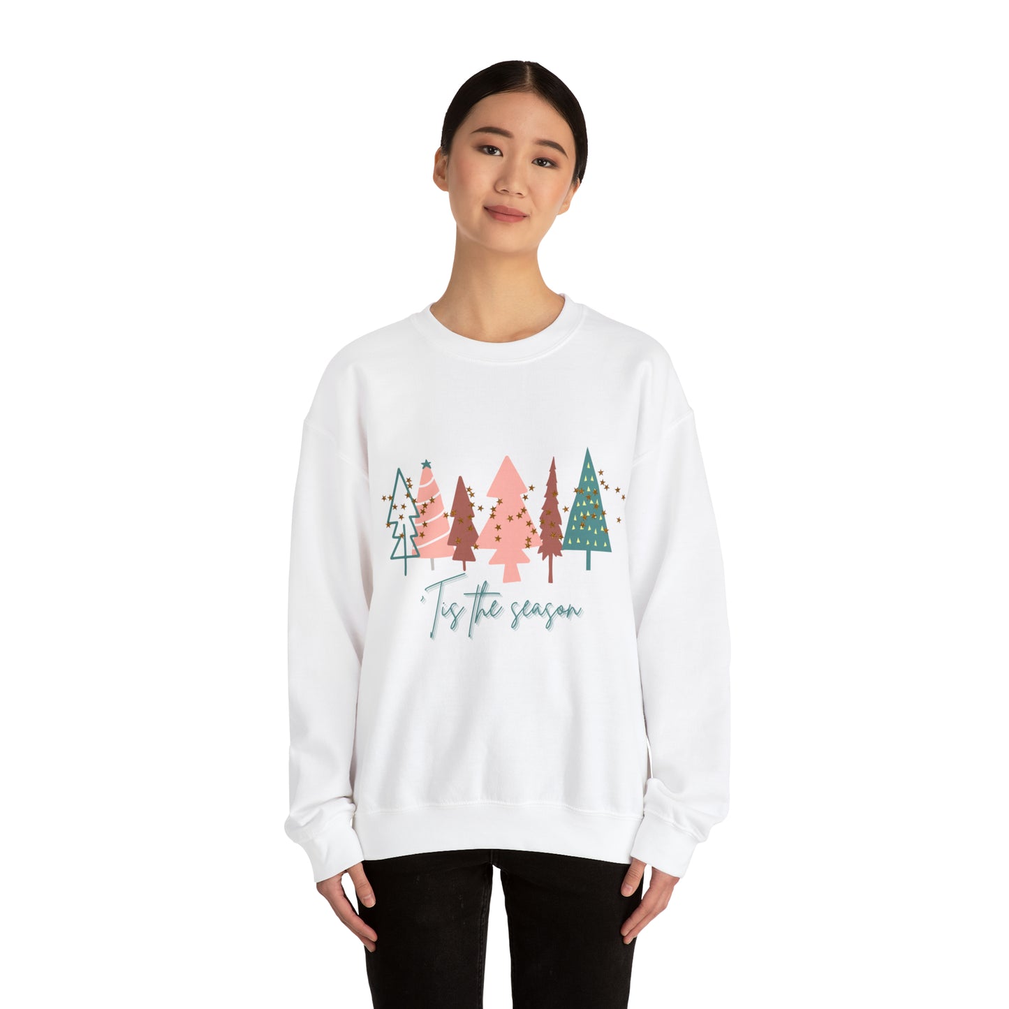A woman cozying up in a Printify Christmas Tree Sweatshirt, perfect for her holiday wardrobe.