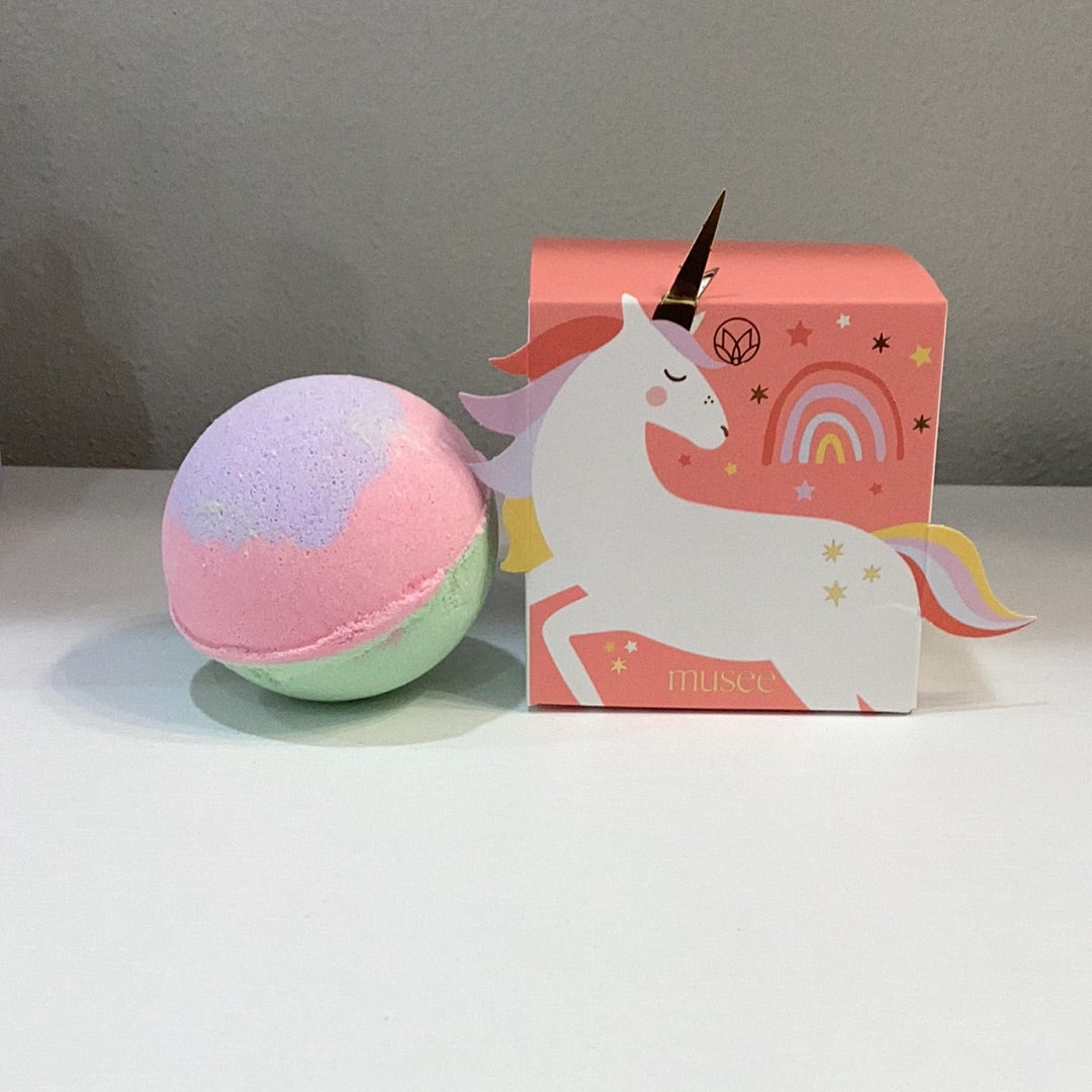 A Musee Unicorn boxed Bath Balm with Surprise inside next to it.