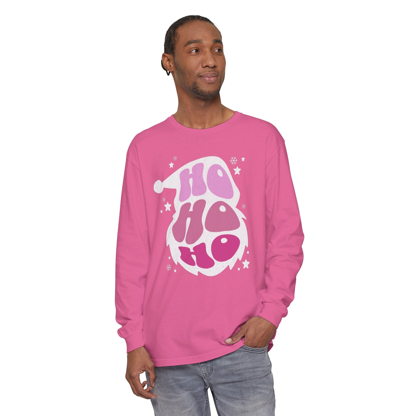A man wearing a cozy pink long sleeve HO HO HO Santa Outline Pink Long Sleeve Tee - Cozy Comfort Colors Unisex Shirt - Crewneck Holiday tee by Printify, showcasing his holiday style.