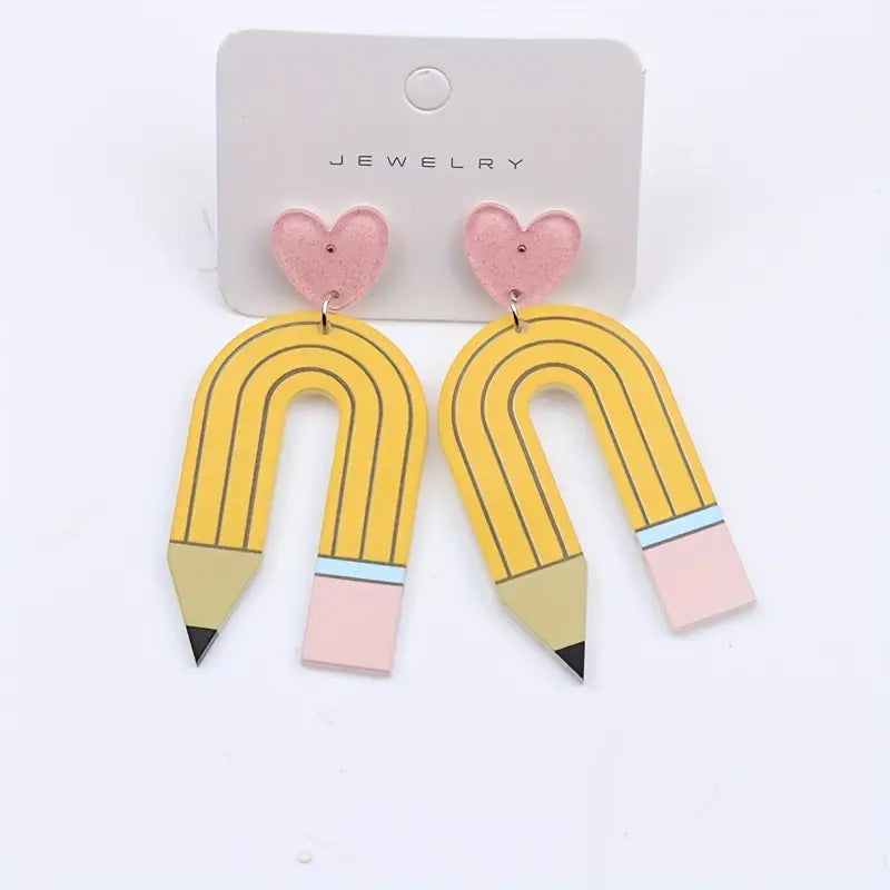 A pair of Heart Pencil Design Dangle Earrings with hearts on them from Chickie Collective.