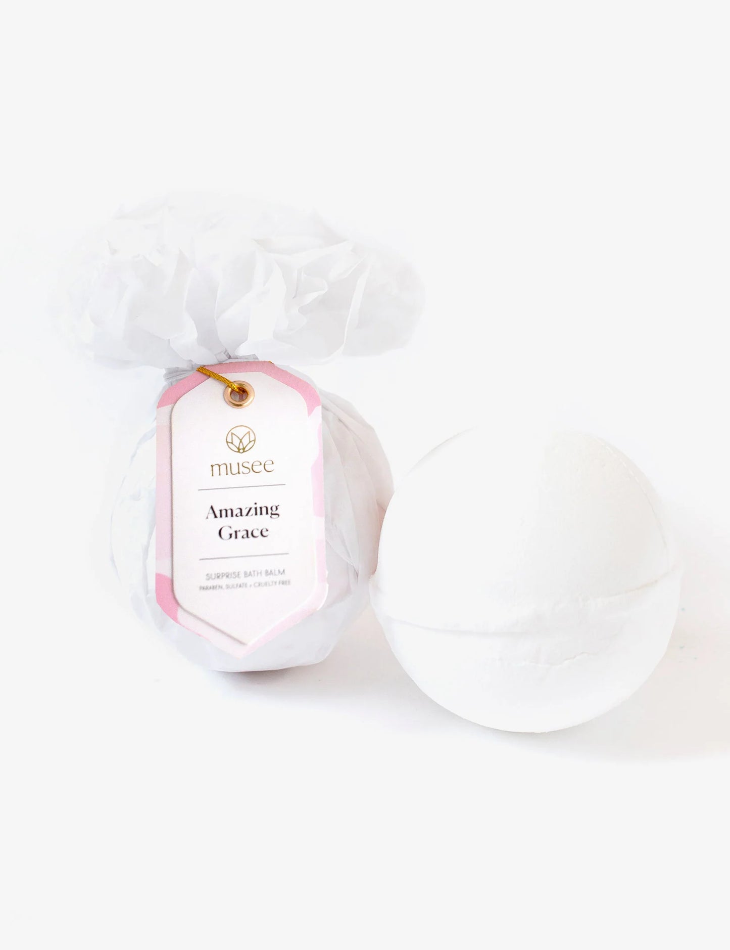 A luxurious Amazing Grace Bath Balm with a pink label by Musee.