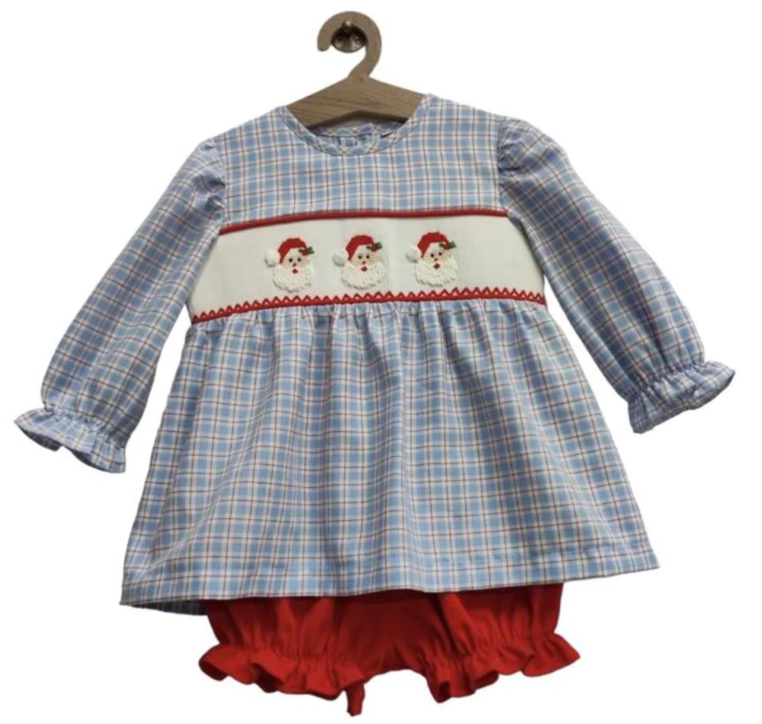 A baby girl's Santa Smock Bloomer Set with ruffled ruffles by Chickie Collective.
