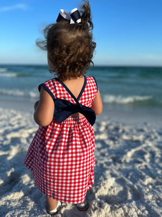 Smocked Independence Girl Dress - Hand Smocked Fireworks Design, Navy Hem, Red Gingham and Navy Kni Kid's Dresses    - Chickie Collective