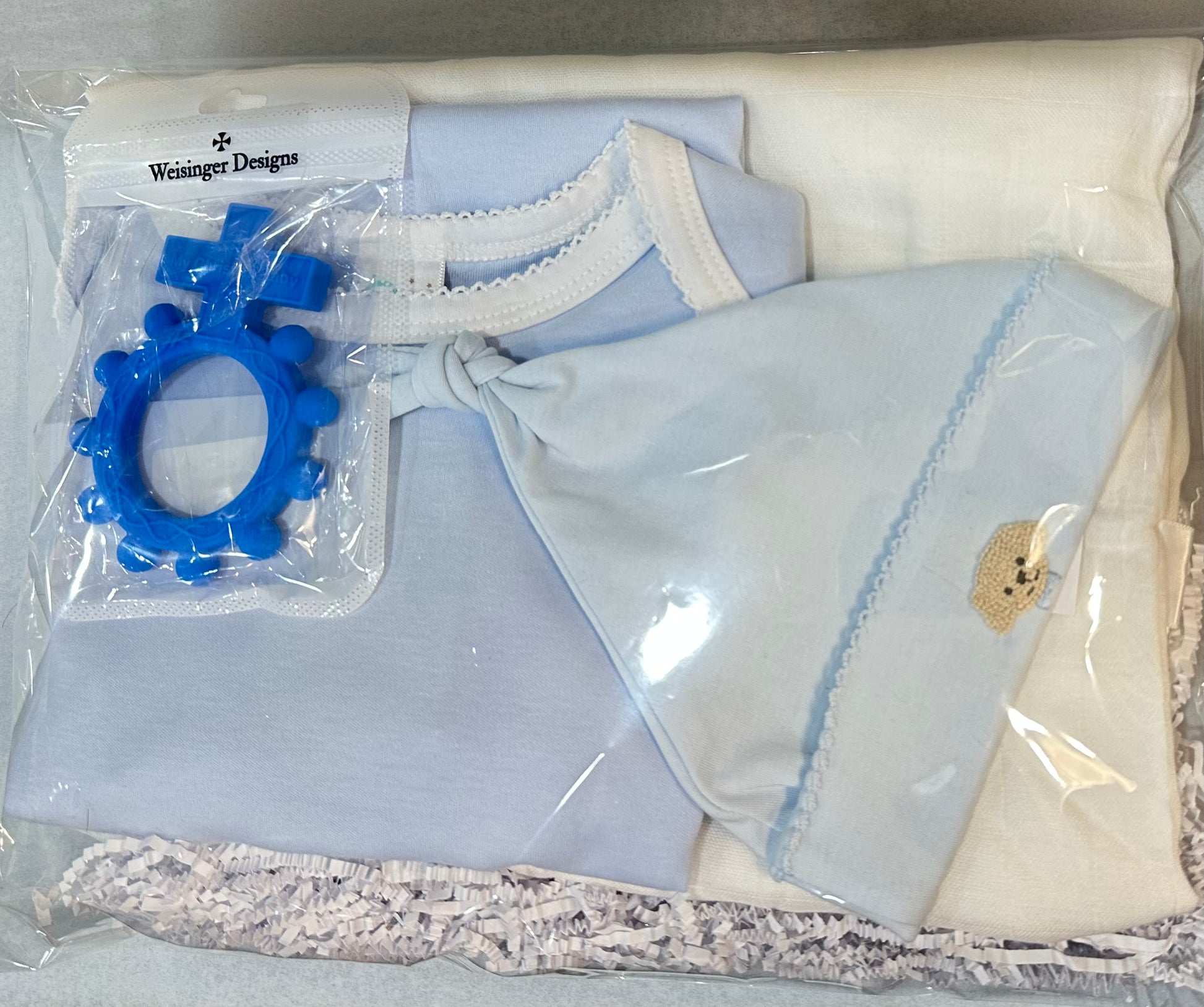 An adorable Baby Boy Bundle from Chickie Collective in a plastic bag.
