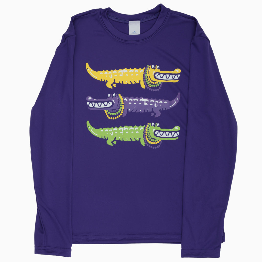 An Azarhia Three Alligators Mardi Gras Long Sleeve Dri Fit Purple Shirt featuring three crocodiles.