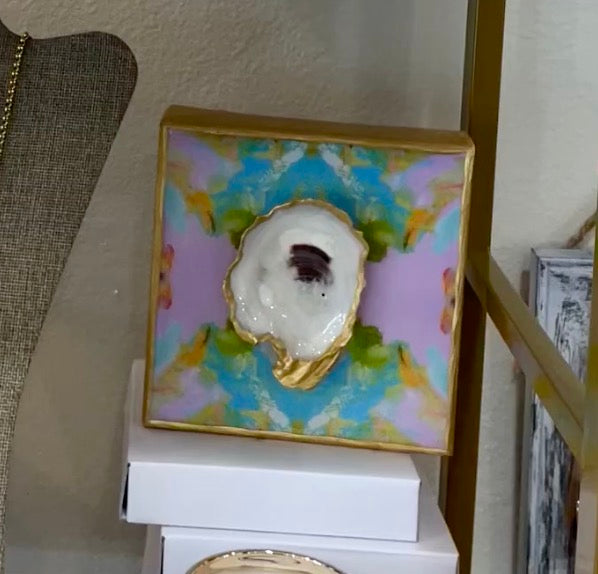 A box with a 4x4 - Glazed Oyster on Printed Canvas by Bella Gifts To Geaux on top of it.