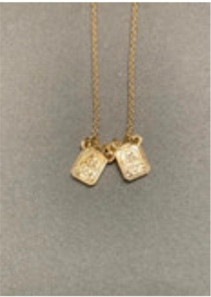 A Weisinger Designs Gold Filled Small Scapular Necklace with two small squares, symbolizing spiritual protection and guidance.