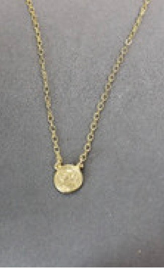 A Sacred Heart Jesus 18" Necklace by Weisinger Designs, with a small coin, providing both protection and faith.