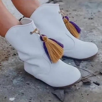 A pair of white boots with Purple & Gold Boot Tassels from SeersuckerJOEY LLC.