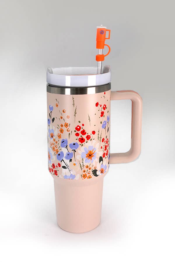 A 40oz STAINLESS STEEL TUMBLER | PETAL LT PINK with a straw, BPA-free and adorned with flowers, made by Wall To Wall Accessories.