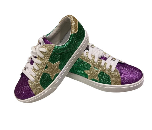 A pair of Women’s Mardi Gras Shoes by Brewer Enterprise, featuring green and purple glitter sneakers.