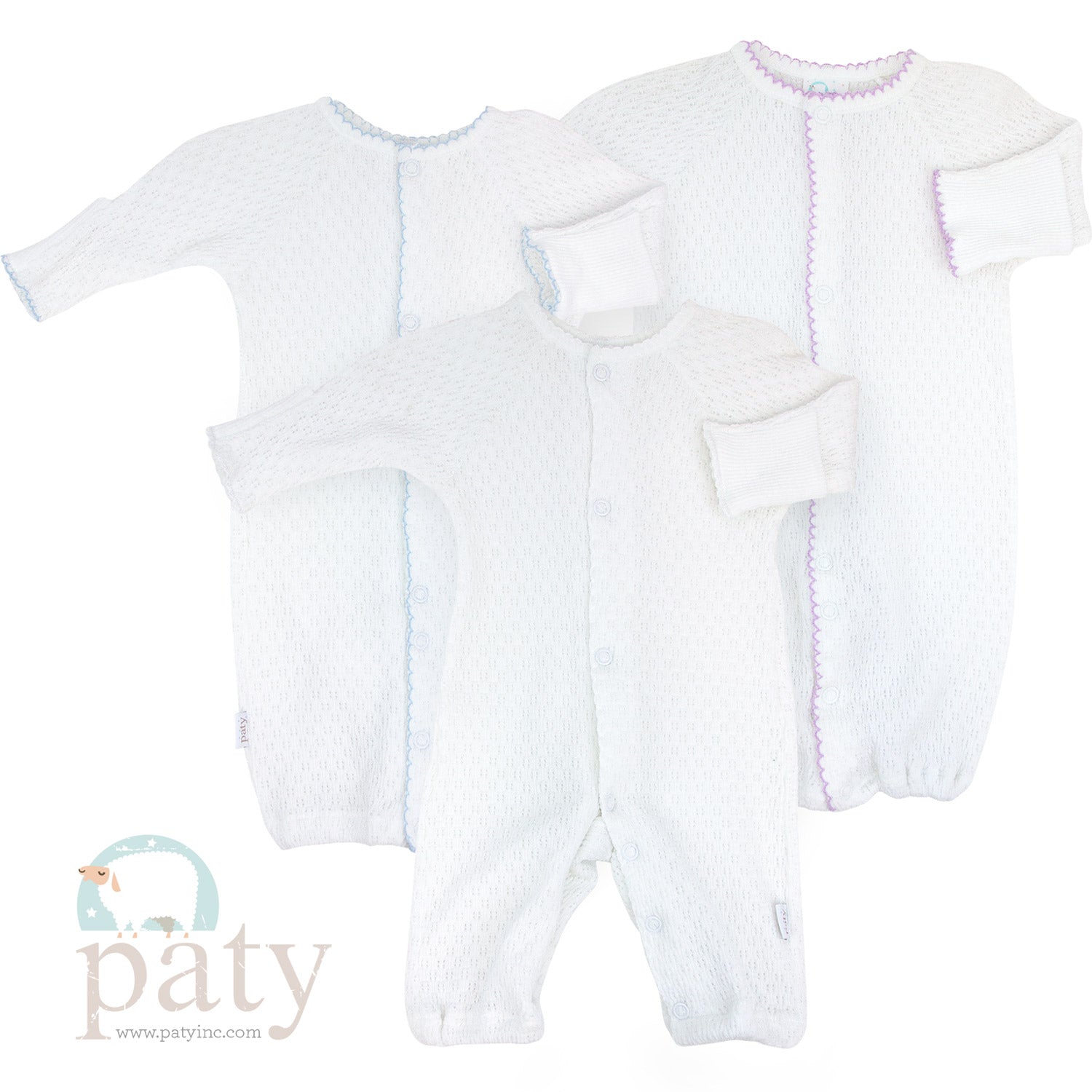 Three white Paty knit converter sleepsuits on a versatile background.