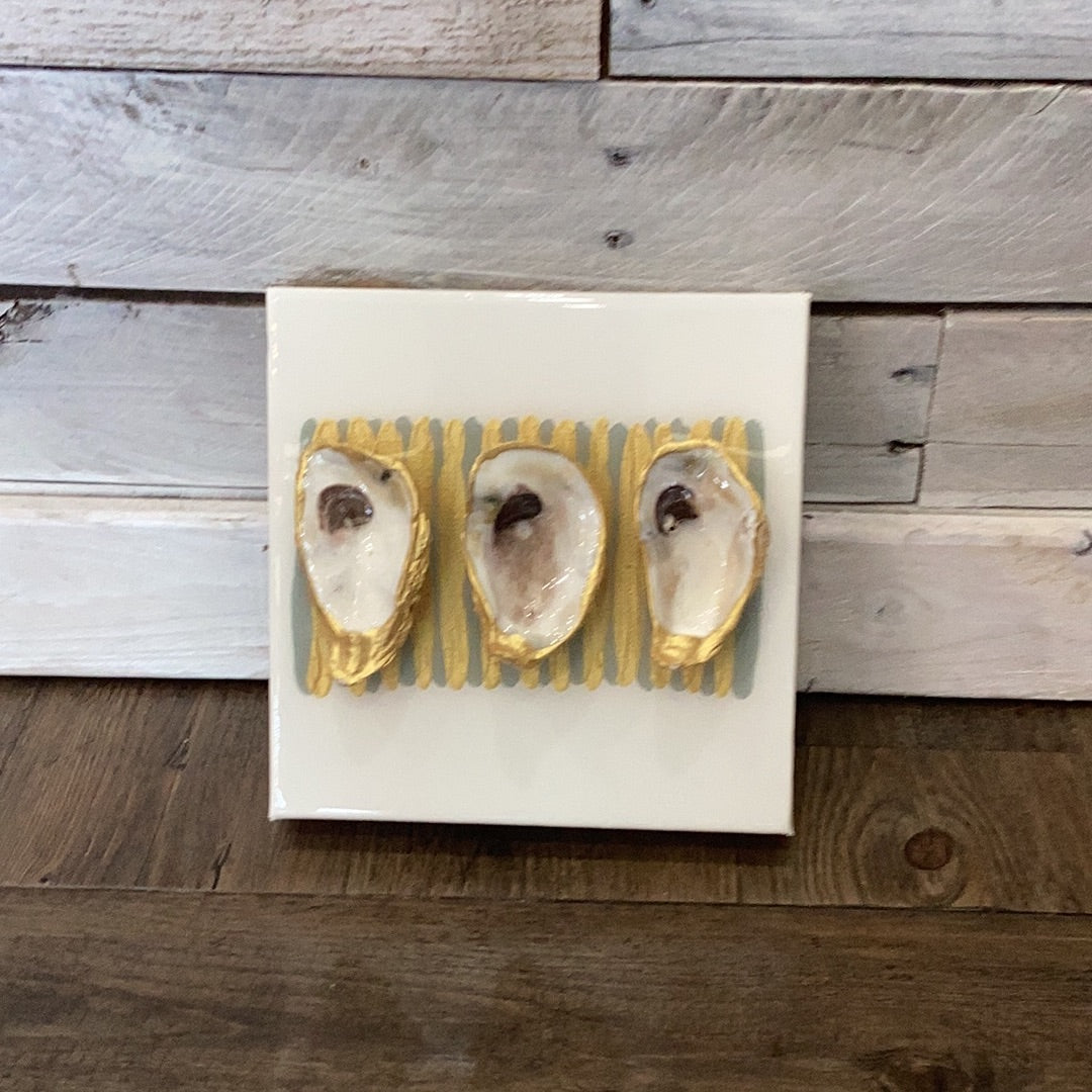 Eight by eight - three oysters - white from Bella Gifts To Geaux on a tile wall.