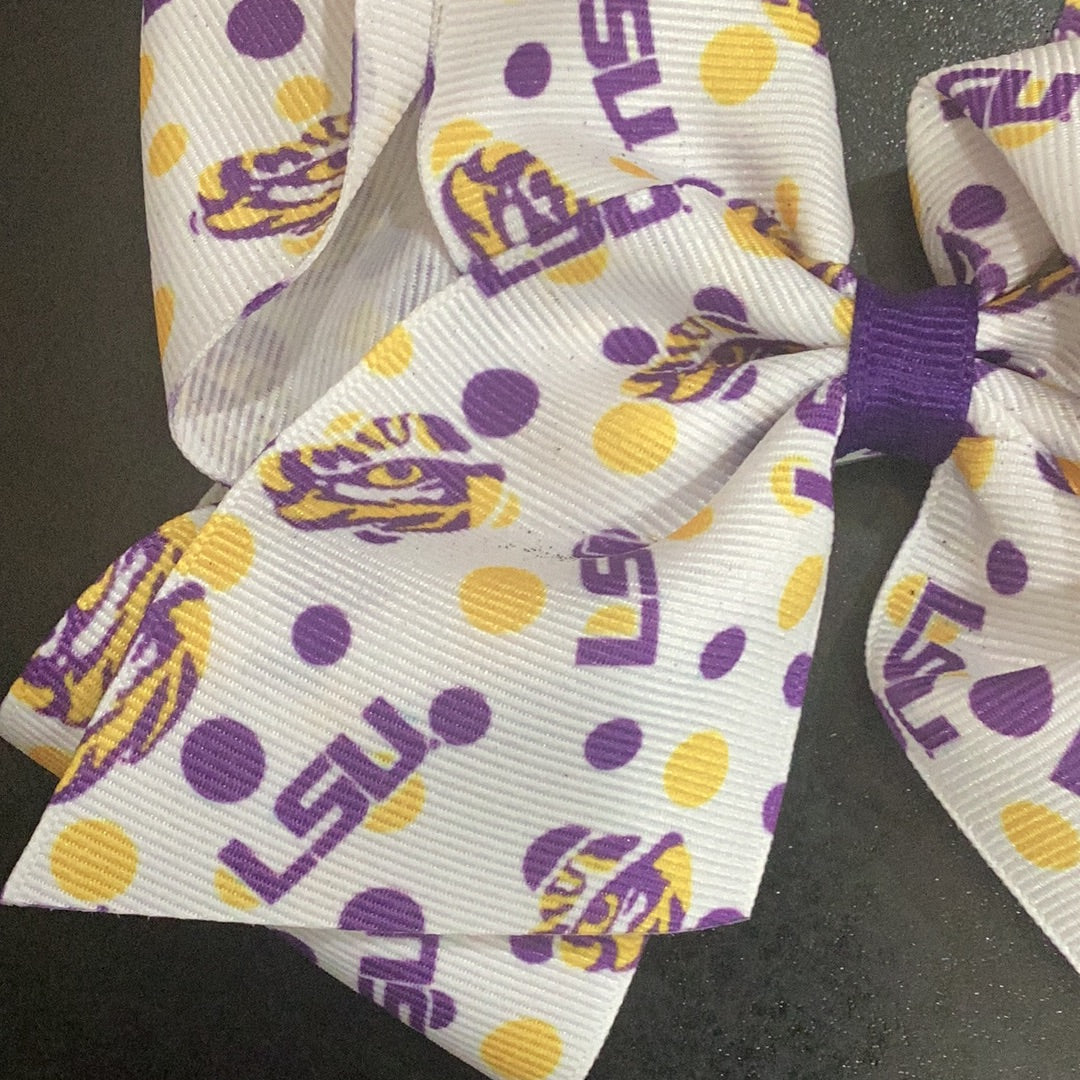 Large purple Wee Ones LSU Tigers polka dot hair bow with a no slip clip.