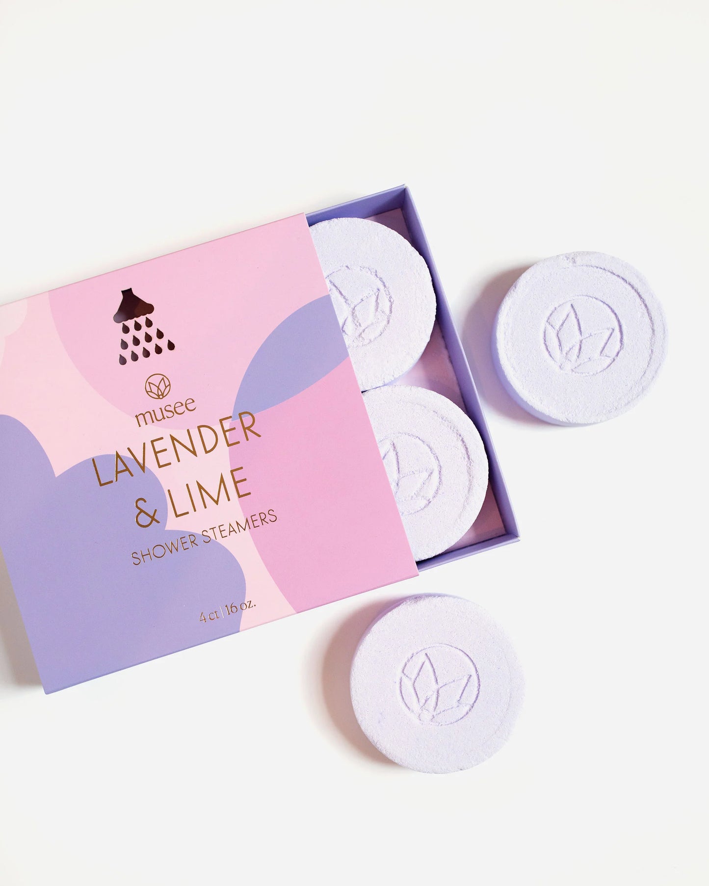 A box of Musee Lavender & Lime Shower Steamers on a white surface.