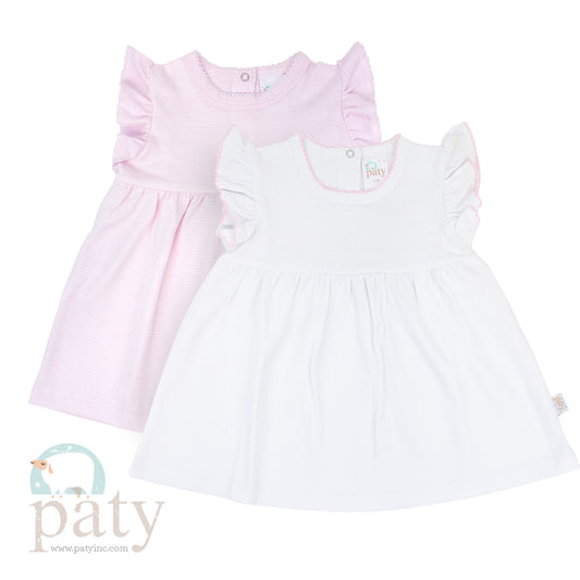 A pair of Paty Ruffle Cotton Dresses in pink and white on a white background.