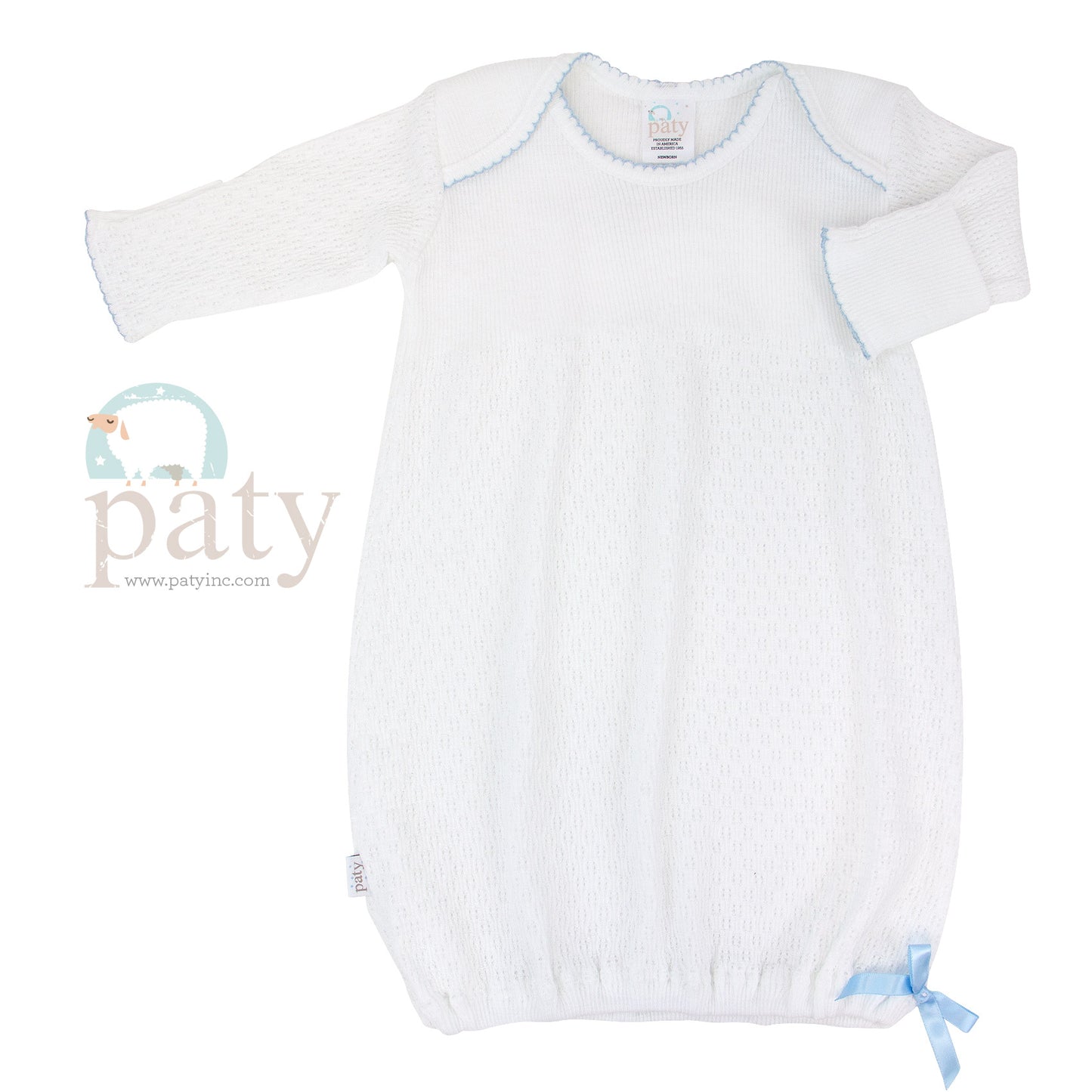 A white Paty baby gown with blue trim, featuring a Signature Paty Gown design for easy-access and made from handmade patented fabric.
