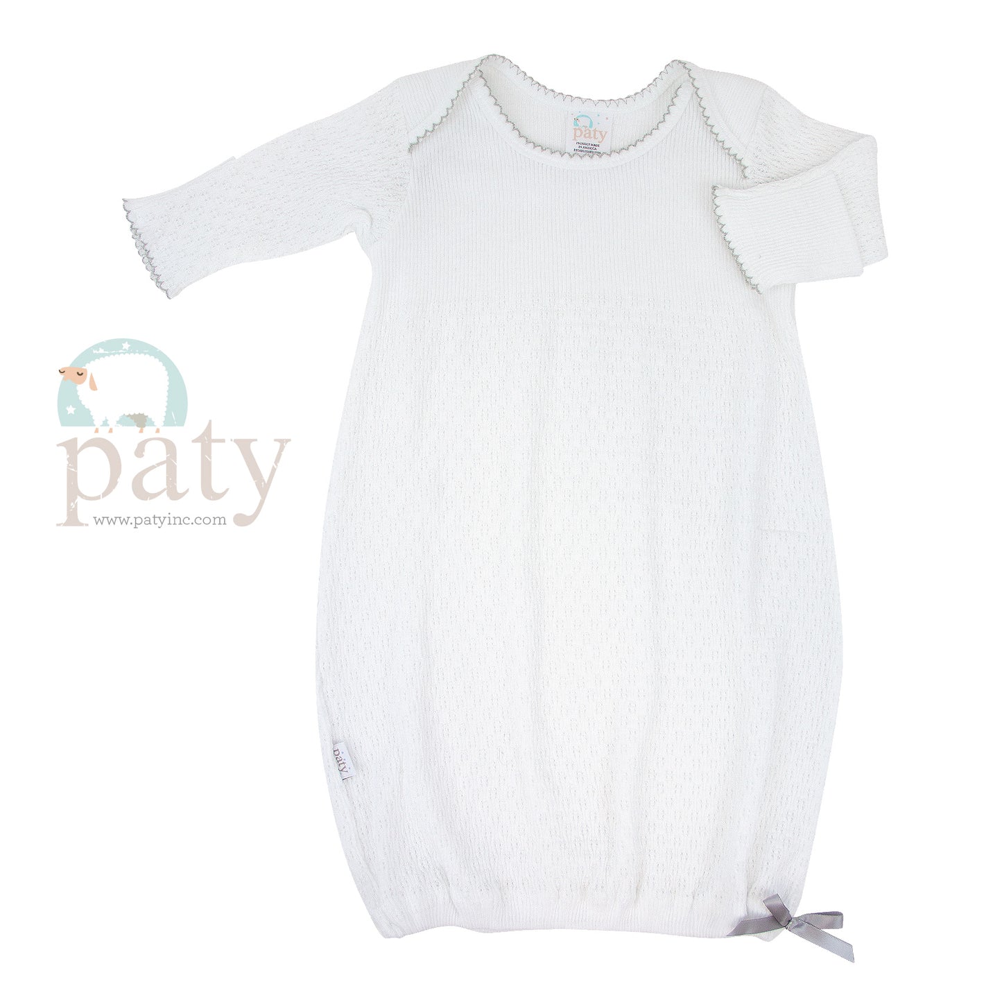 A white Paty baby gown with a grey bow, featuring an easy-access design.