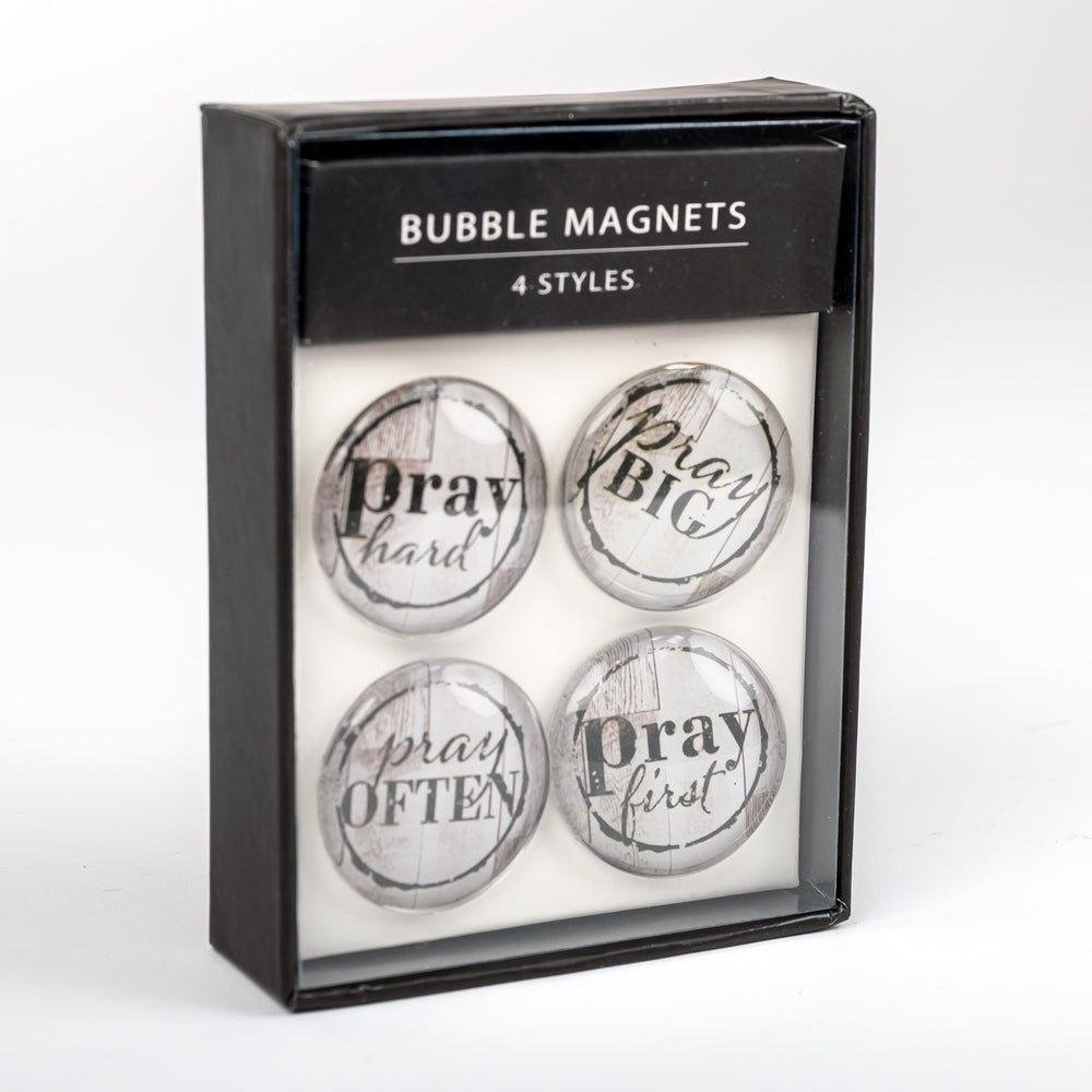 A package of four Nicole Brayden Prayer Bubble Magnets with the words pray often printed on them.