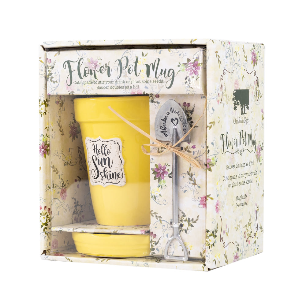 A Nicole Brayden Hello Sunshine Yellow Flower Pot Mug and Spoon Set in a box.